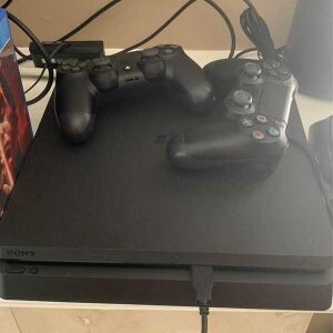 preowned play station 4 pro with two controllers