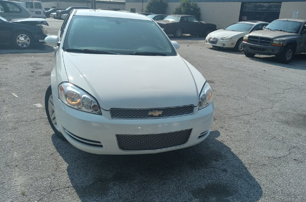 Very clean 2016 chevy Impala, white 4 dr. ,A/C low